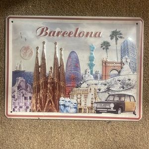 Barcelona metal sign with four holes in the corners for secured hanging. Art